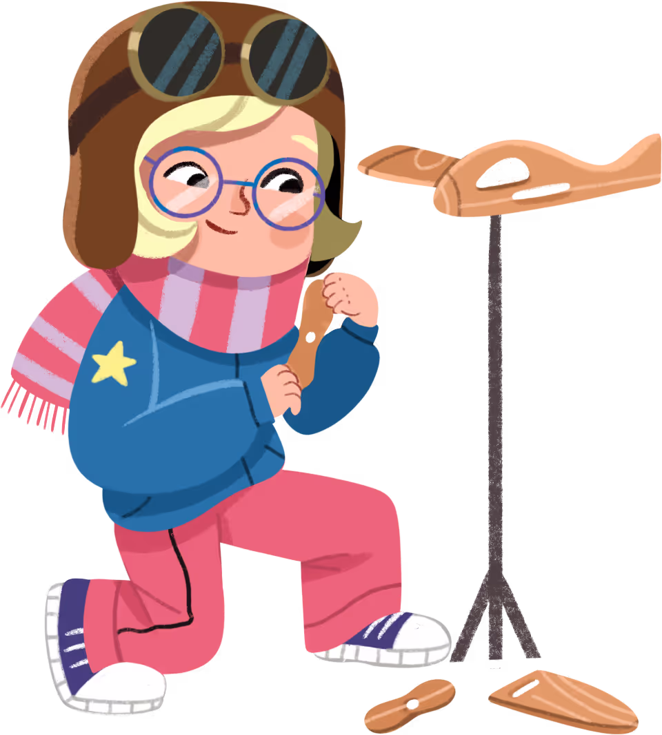 A girl assembling a wooden airplane.