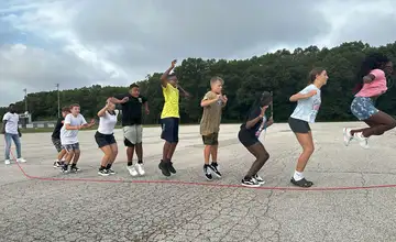 Students jumping rope together outdoors